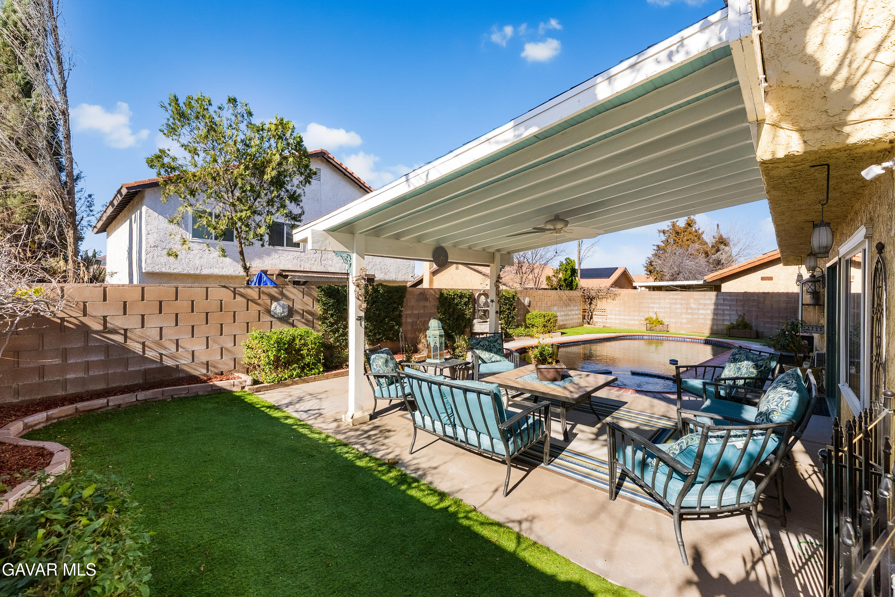 44003 7th Street East Lancaster, CA 93535 - Photo 47 of 62 a view of a patio with table and chairs and potted plants