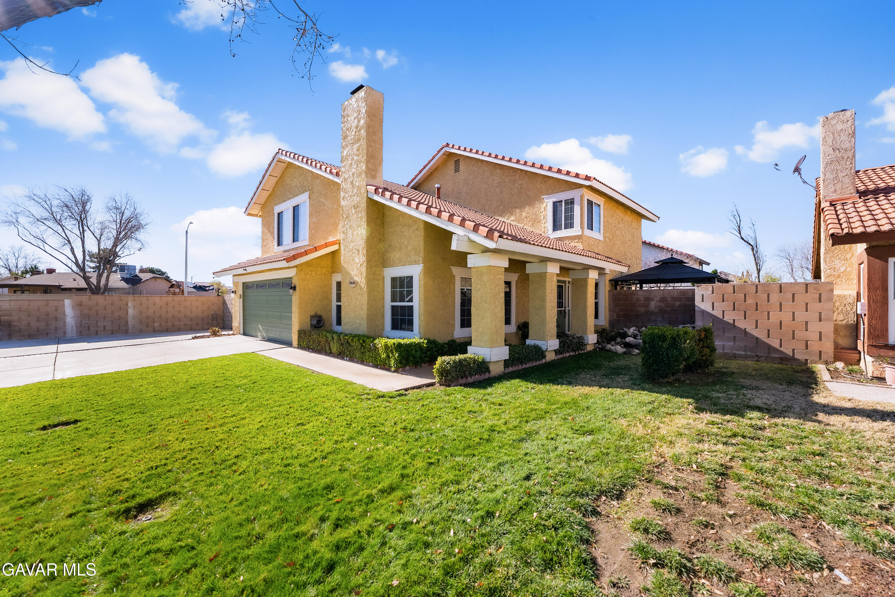 44003 7th Street East Lancaster, CA 93535 - Photo 6 of 62 a view of a house with a yard