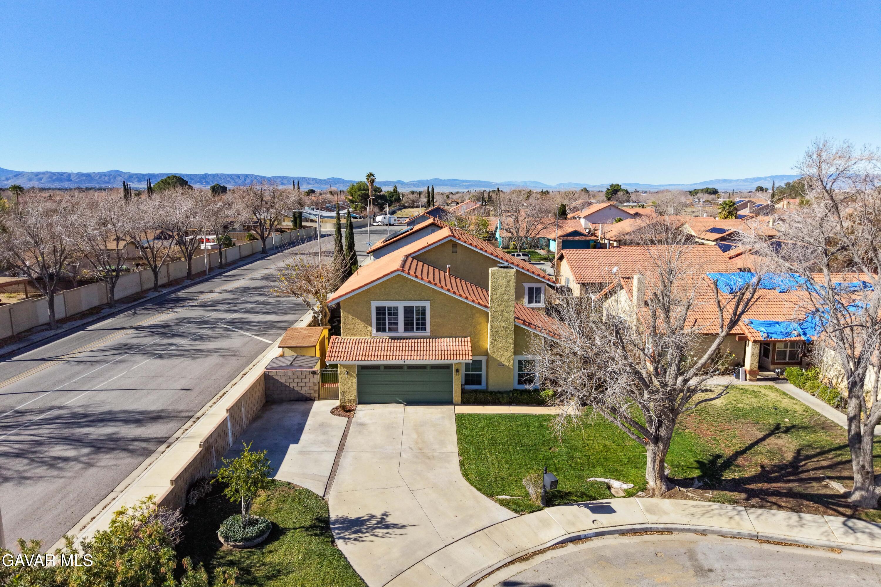 44003 7th Street East Lancaster, CA 93535 - Photo 8 of 62 a view of a house with a yard