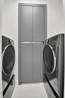 a view of a storage & utility room with a sink