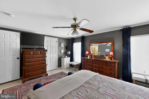 a bed room with a bed and a television