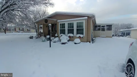 a group of people sitting in front of building