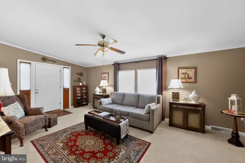 a living room with furniture and a rug