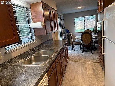 1005 Maple Street Myrtle Point, OR 97458 - Photo 12 of 32 a kitchen with a sink cabinets and appliances