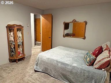 1005 Maple Street Myrtle Point, OR 97458 - Photo 16 of 32 a bedroom with a bed and painting on the wall