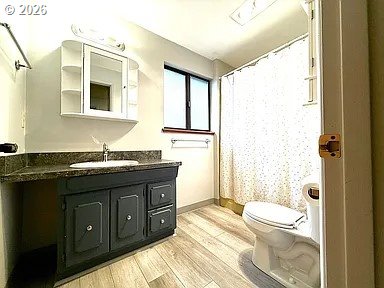 1005 Maple Street Myrtle Point, OR 97458 - Photo 20 of 32 a spacious bathroom with a granite countertop sink toilet and shower