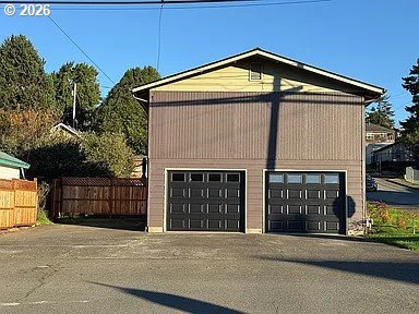 1005 Maple Street Myrtle Point, OR 97458 - Photo 2 of 32 a front view of a house with a garage