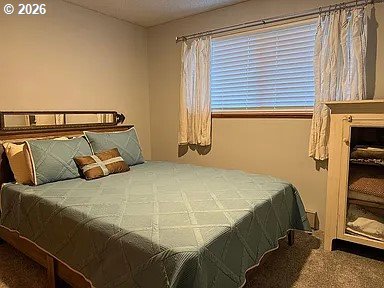 1005 Maple Street Myrtle Point, OR 97458 - Photo 21 of 32 a bedroom with a bed and a window