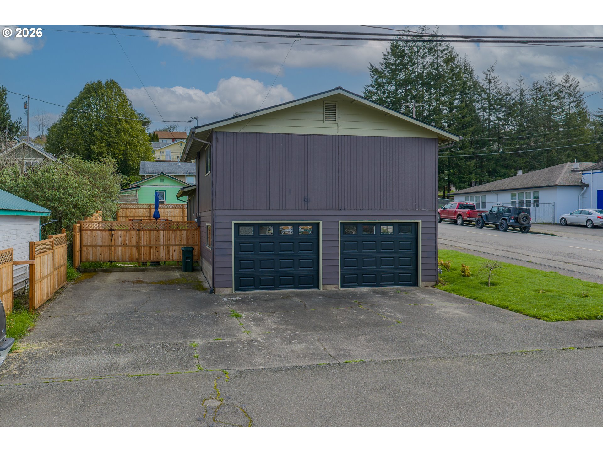 1005 Maple Street Myrtle Point, OR 97458 - Photo 27 of 32 a view of a house with a yard and garage