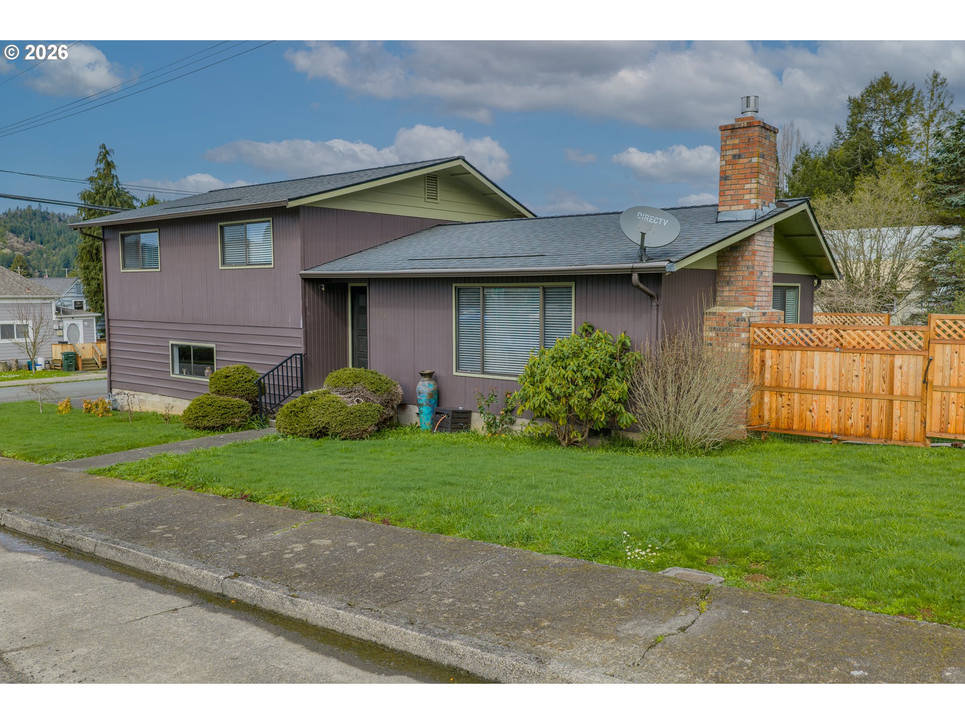 1005 Maple Street Myrtle Point, OR 97458 - Photo 30 of 32 a front view of a house with garden