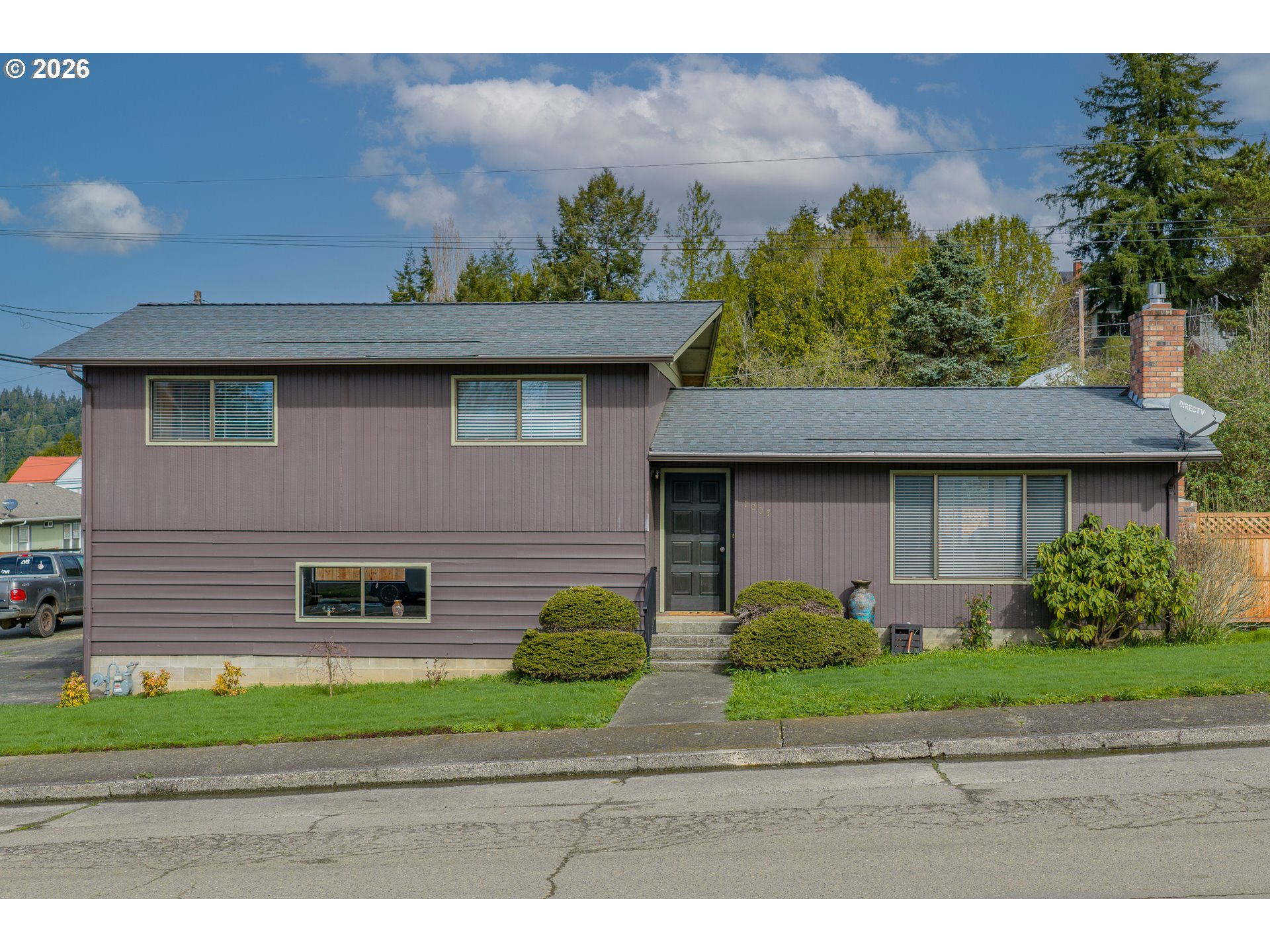1005 Maple Street Myrtle Point, OR 97458 - Photo 31 of 32 a front view of a house with a yard and garage