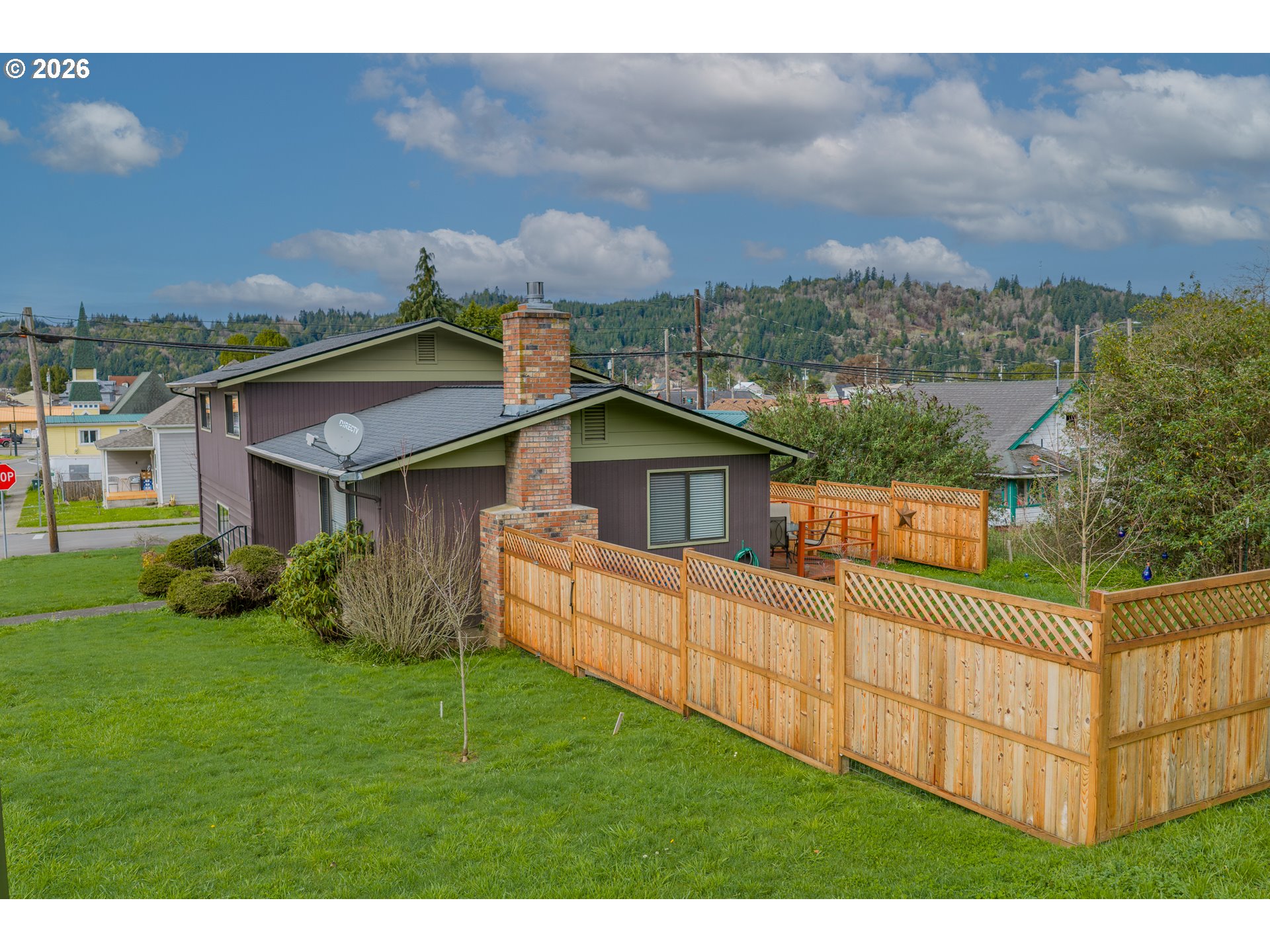 1005 Maple Street Myrtle Point, OR 97458 - Photo 32 of 32 a view of house with backyard outdoor seating and hardwood