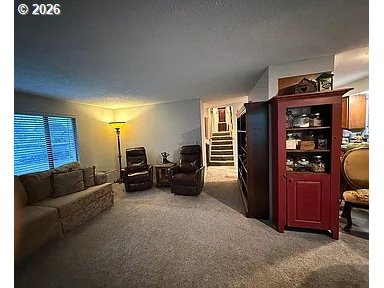 1005 Maple Street Myrtle Point, OR 97458 - Photo 6 of 32 a bed room with furniture and a lamp