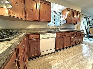 1005 Maple Street Myrtle Point, OR 97458 - Photo 10 of 32 a kitchen with stainless steel appliances granite countertop wooden cabinets a sink and dishwasher
