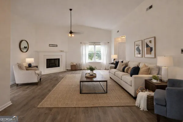 a view of a kitchen with wooden floor