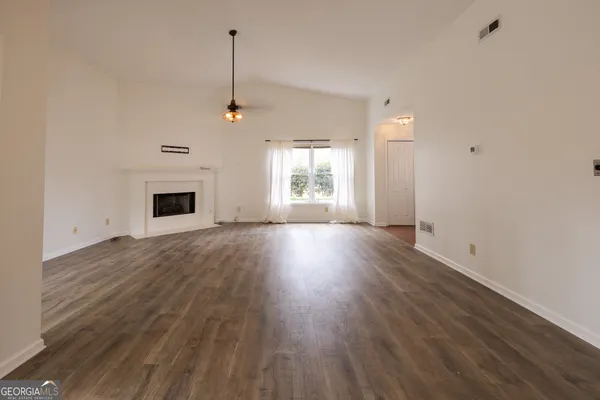 a view of a livingroom with wooden floor
