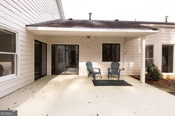 a view of a house with a yard and garage