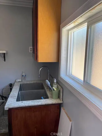 a bathroom with a sink and mirror