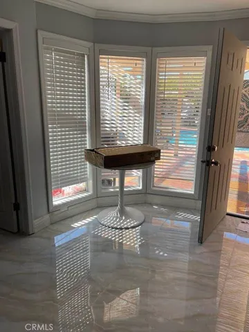 a room with wooden floor and a window