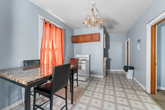 a view of a dining room with furniture and window