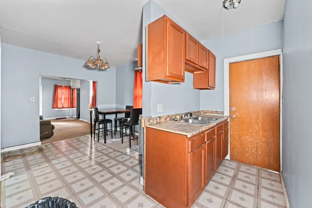 a kitchen with stainless steel appliances granite countertop a stove and a refrigerator