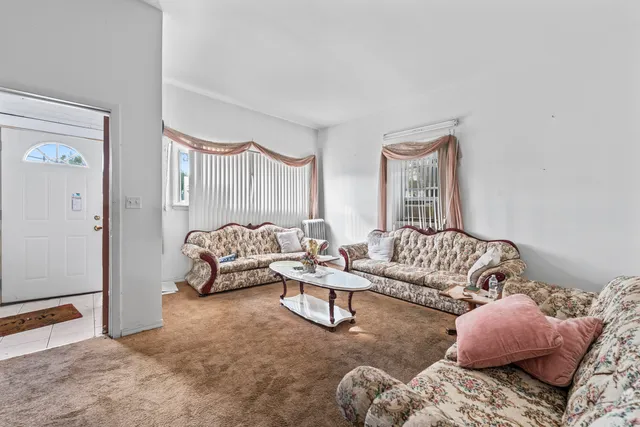 a living room with furniture and a couch