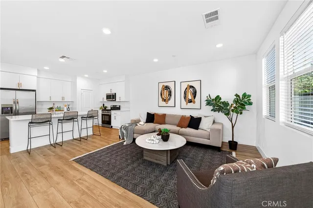 a living room with furniture and a table