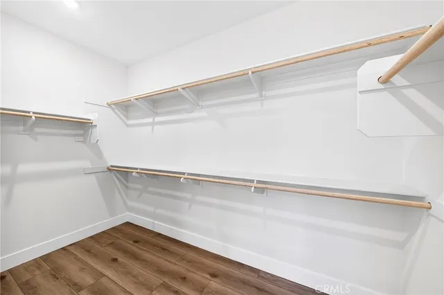 a view of a room with wooden floor and staircase