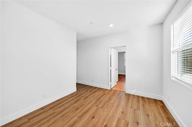 a bathroom with a granite countertop toilet a sink and bathtub