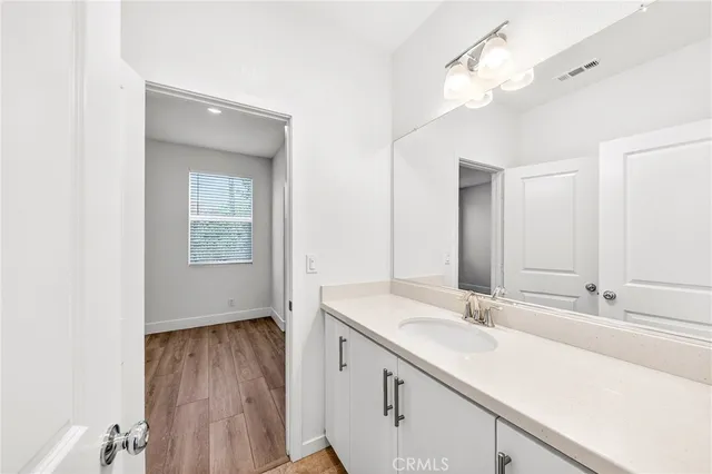 a white toilet sitting next to a bath tub