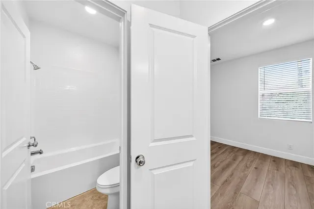 a bathroom with a sink a mirror and a shower