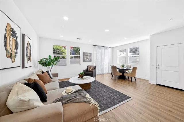 a view of a dining room with furniture and window