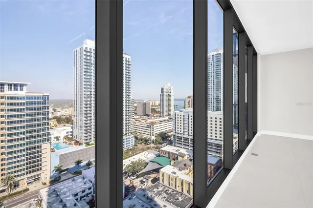a bathroom with a shower a toilet and sink