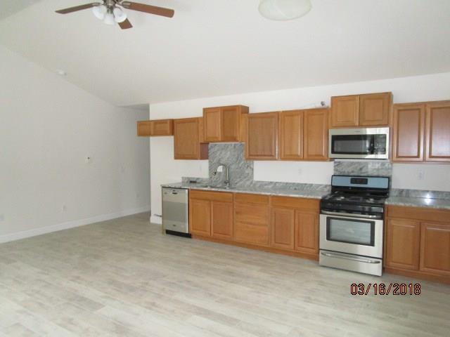 KITCHEN AREA WITH STAINLESS STEEL...