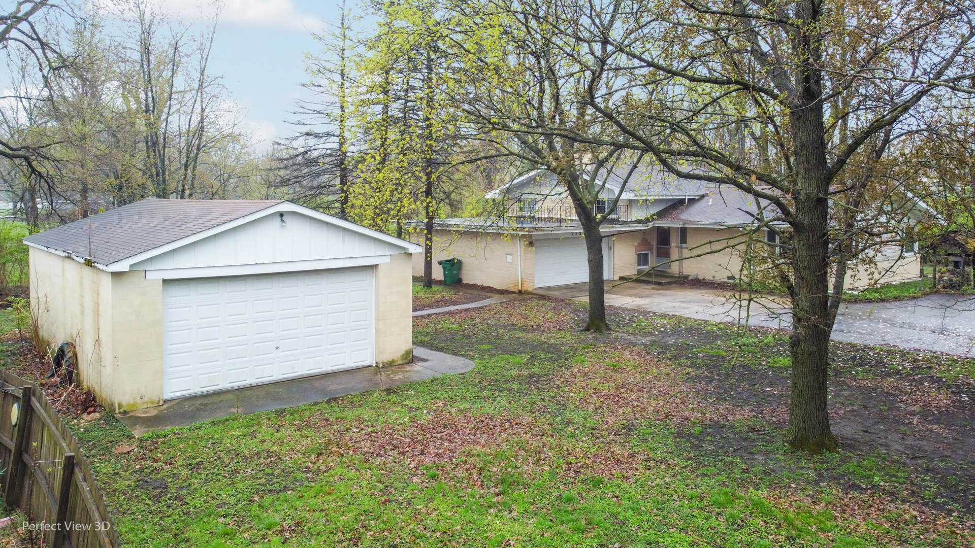 229 West Cermak Road Braidwood, IL 60408 - Photo 22 of 27 a view of a house with a yard and garage