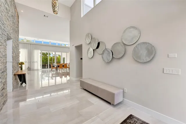 a living room with couches and painted walls