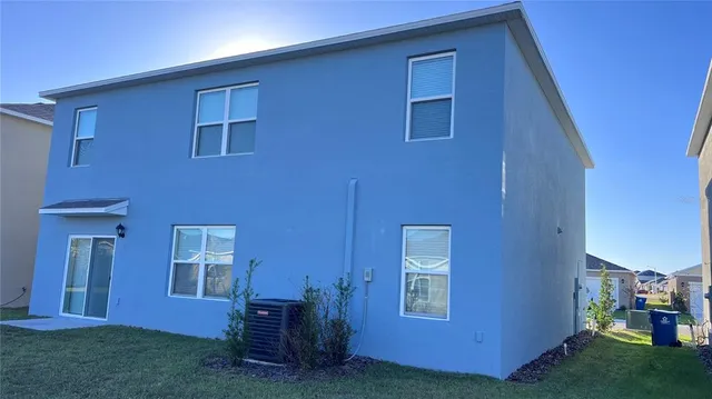a view of backyard with seating space