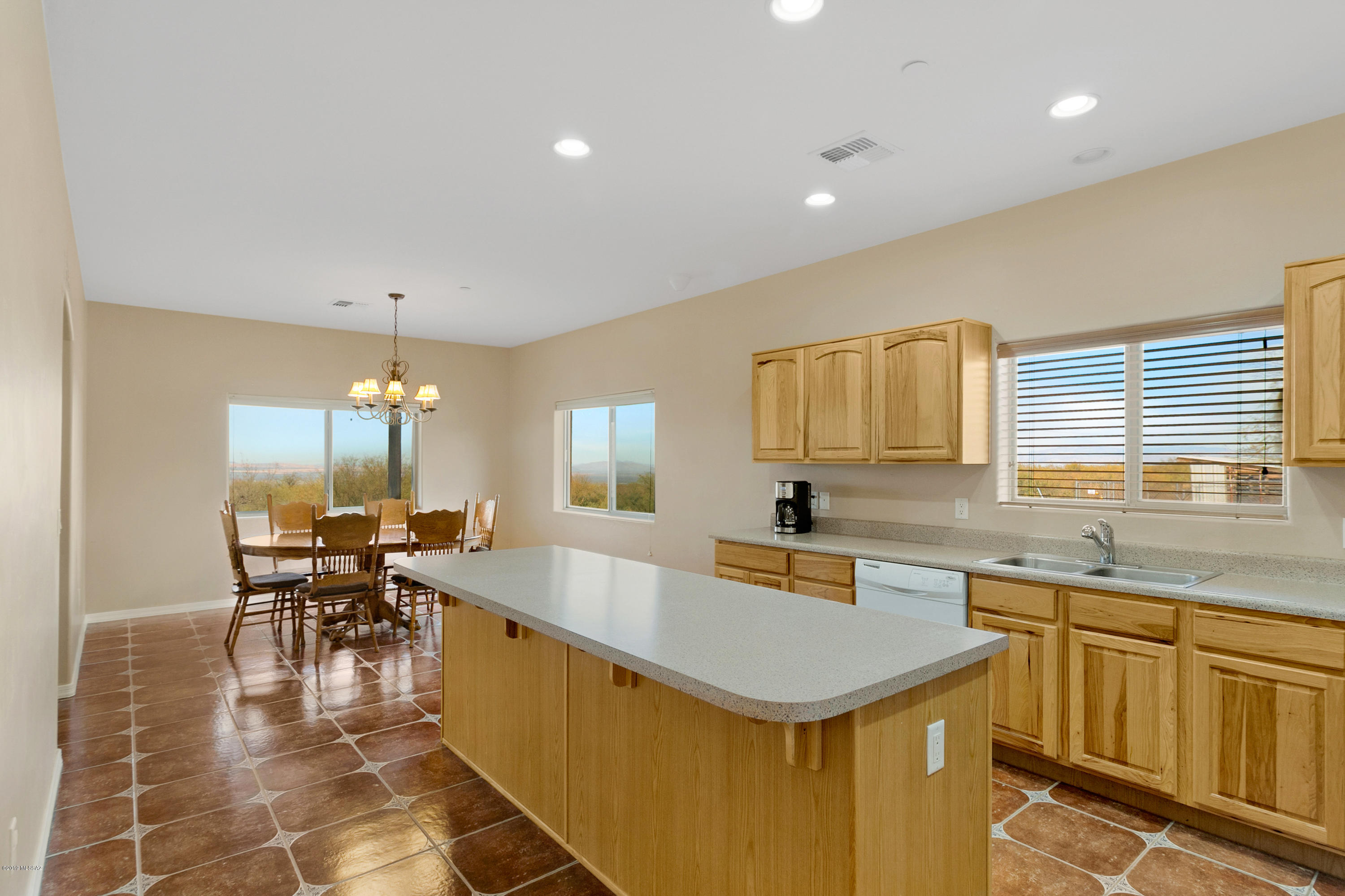 21960 South Helvetia Road Sahuarita, AZ 85629 - Photo 9 of 29 a kitchen with a sink a counter top space and appliances