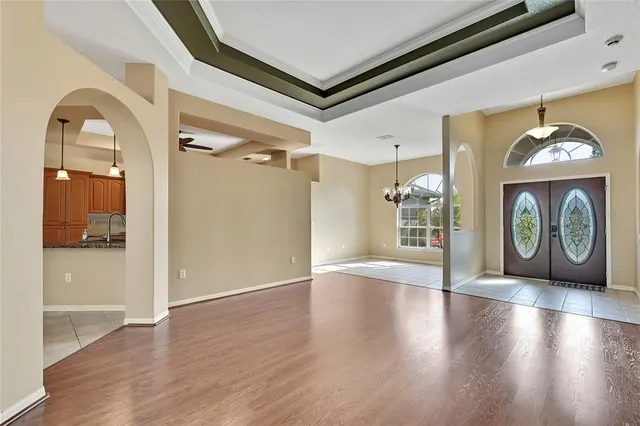 a view of a livingroom with furniture window and wooden floor