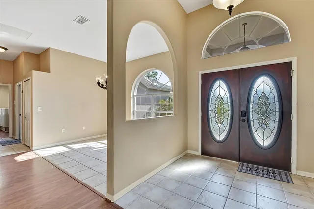 a kitchen with stainless steel appliances granite countertop a refrigerator a sink and dishwasher