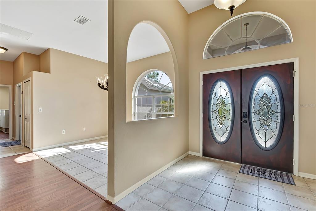 12403 Centennial Street Spring Hill, FL 34609 - Photo 12 of 62 a view of a livingroom with wooden floor and a window