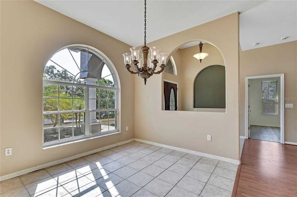 12403 Centennial Street Spring Hill, FL 34609 - Photo 14 of 62 a view of a livingroom with furniture window and wooden floor