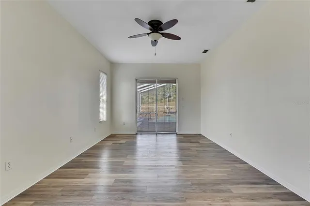 a bathroom with a granite countertop sink a toilet and a mirror