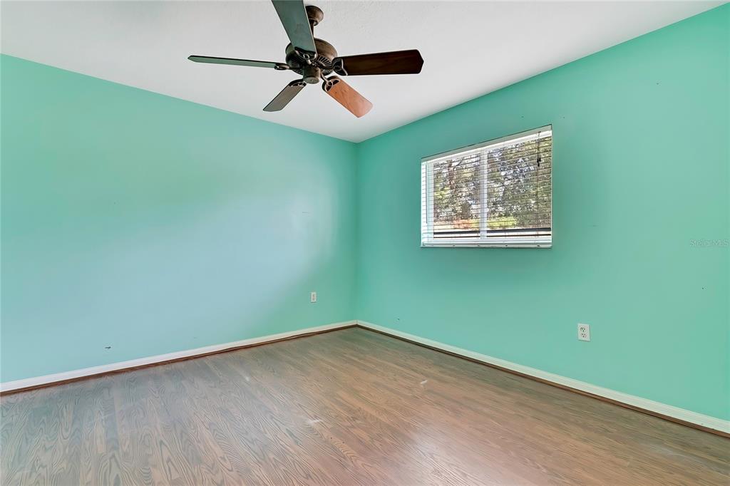 12403 Centennial Street Spring Hill, FL 34609 - Photo 38 of 62 a view of a room with a ceiling fan and a window