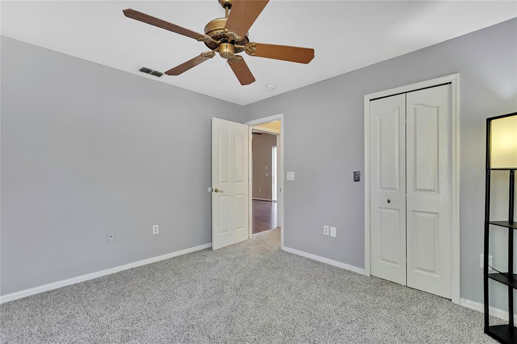 12403 Centennial Street Spring Hill, FL 34609 - Photo 43 of 62 a view of room with a ceiling fan