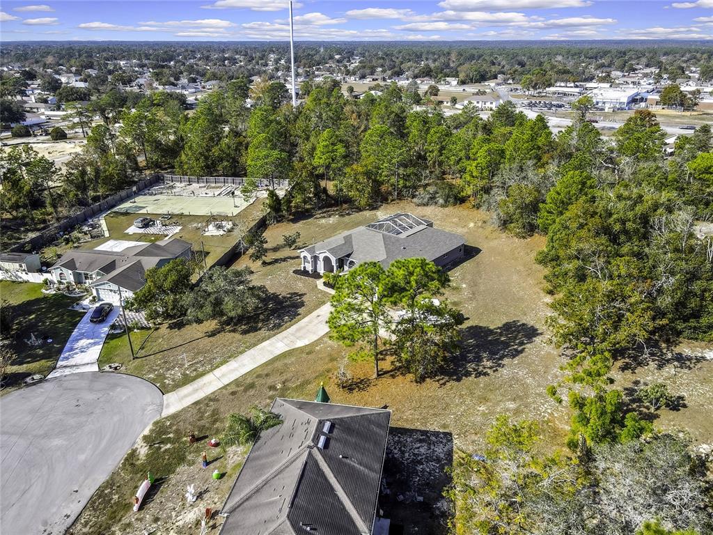 12403 Centennial Street Spring Hill, FL 34609 - Photo 54 of 62 an aerial view of residential houses with outdoor space