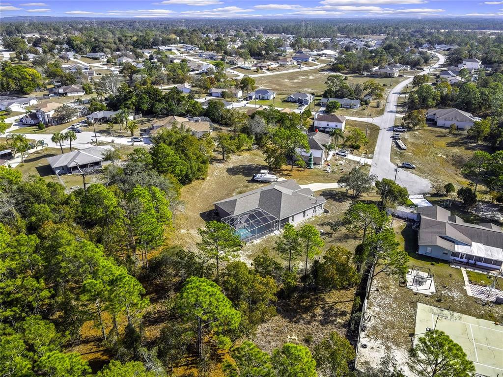 12403 Centennial Street Spring Hill, FL 34609 - Photo 58 of 62 an aerial view of residential houses with outdoor space and trees