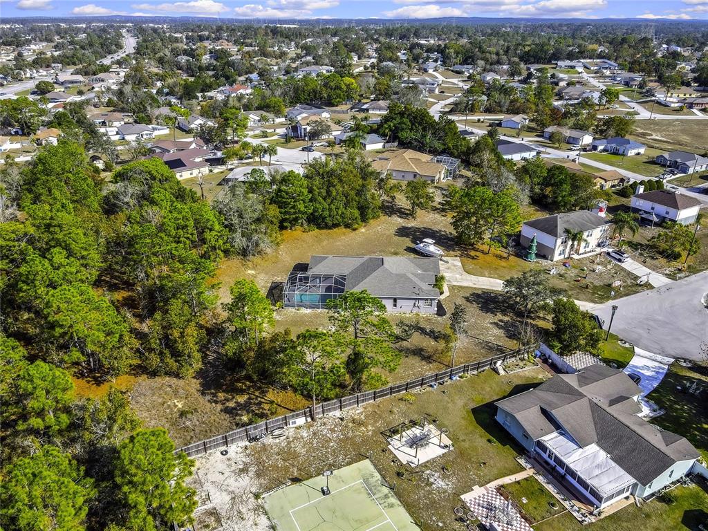 12403 Centennial Street Spring Hill, FL 34609 - Photo 59 of 62 an aerial view of residential houses with outdoor space