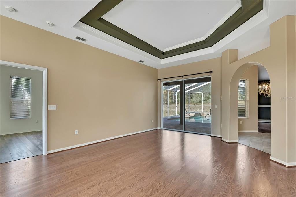 12403 Centennial Street Spring Hill, FL 34609 - Photo 8 of 62 a view of an entryway with wooden floor