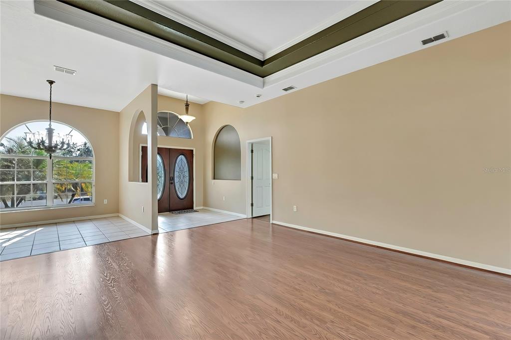 12403 Centennial Street Spring Hill, FL 34609 - Photo 9 of 62 a view of a hallway with wooden floor and a window